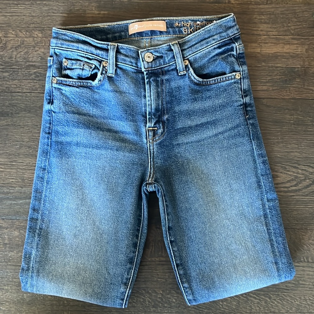 7 for All Mankind. Size 26. The denim that hugs your body perfectly.